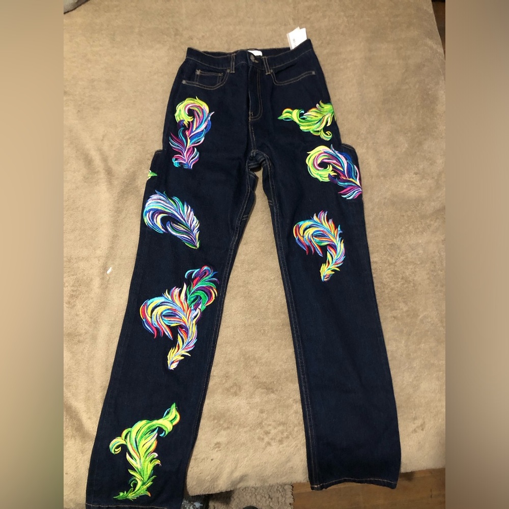 AREA
embroidered feather back-slit jeans size 0